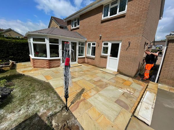 The new sandstone nearly finished, with work continuing along the side of the house