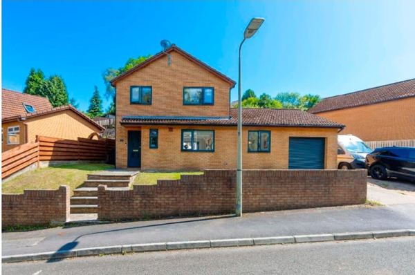 Before: low red brick wall, sloping lawn and plain brick steps