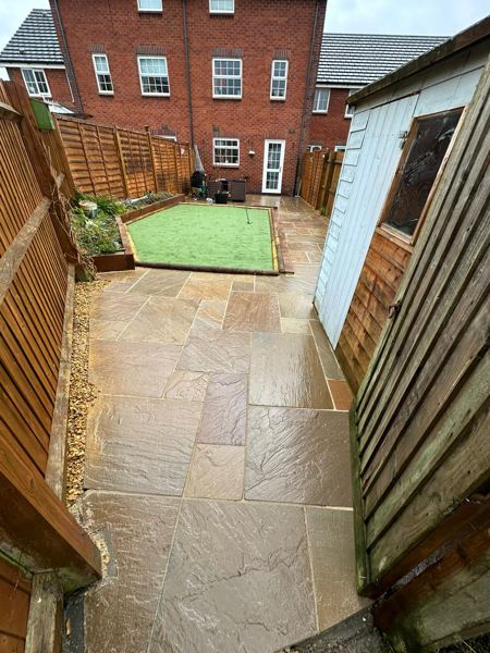 Looking back towards the house along the new sandstone path past the shed