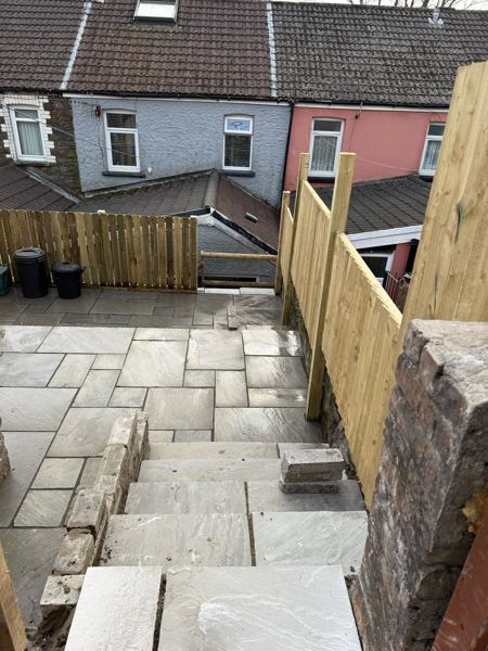 Looking down the new sandstone steps to the lower patio level and terraces beyond