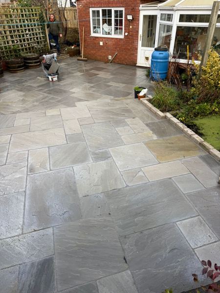 Looking back towards the house and conservatory, edging stones along the border