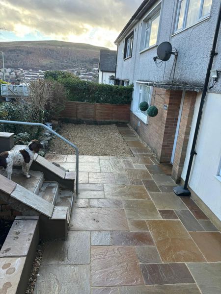 The finished side path and gravel area, with steps and the valley behind